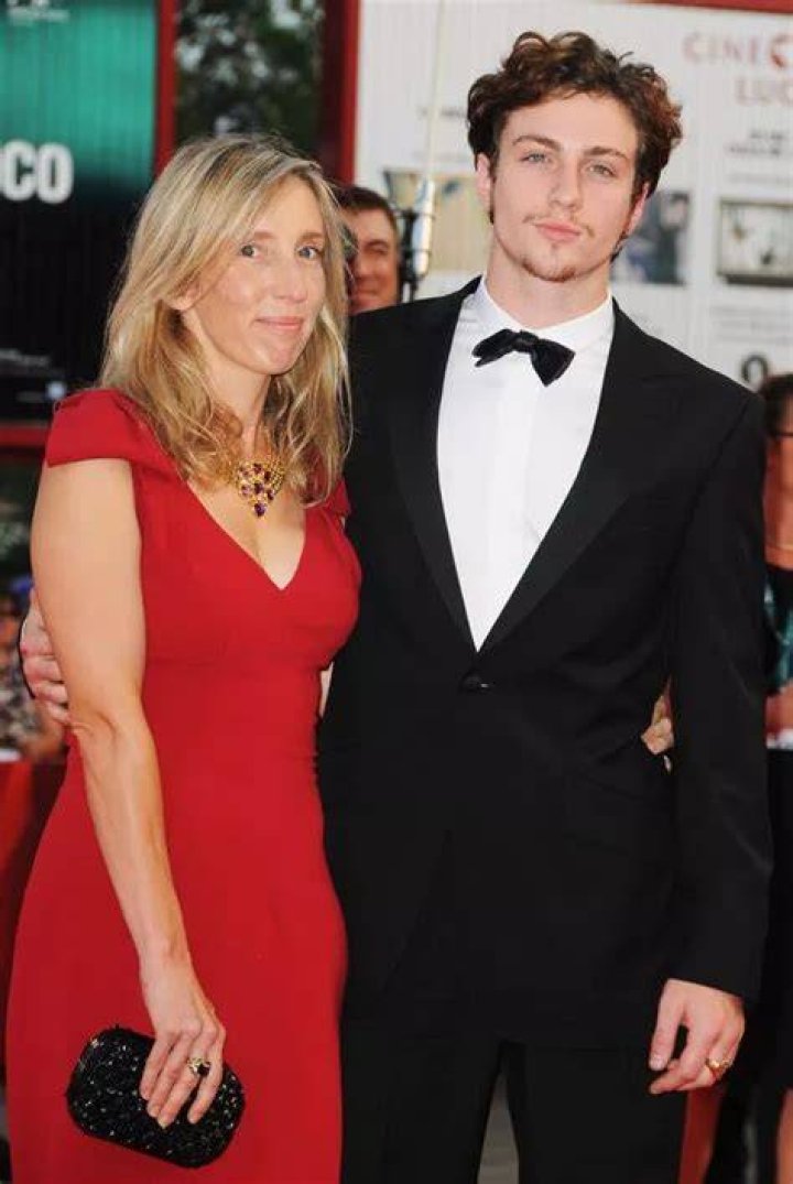 Sam TaylorJohnson, 52, and husband Aaron, 28, wear matching neutral